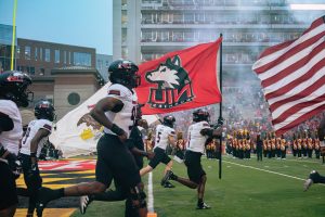 The NIU football team runs onto the field before the Huskies’ matchup against the University of Maryland on Sept. 5 at SECU Stadium in College Park, Maryland. NIU fell to Mississippi State University 38-10 on Saturday. (Totus Tuus Keely | Northern Star)