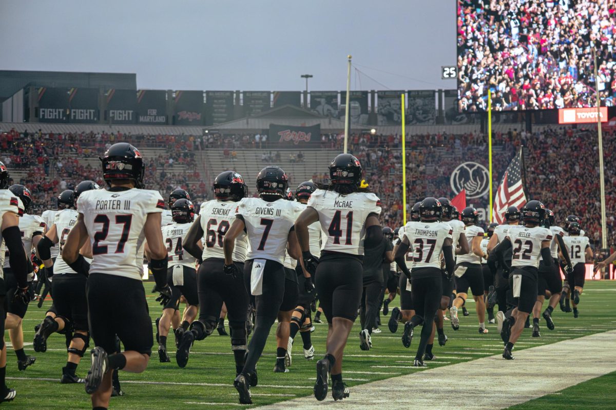 Members of the NIU football take the field on Sept. 5 at SECU Stadium in College Park, Maryland ahead of their matchup with the University of Maryland. On Saturday, the Huskies went into halftime trailing the Mississippi State University Bulldogs by a score of XX-X. (Totus Tuus Keely | Northern Star)