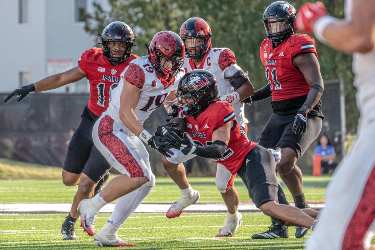 NIU junior safety Jasper Beeler (22) intercepts a bobbled pass from San Diego State University junior quarterback Jayden Denegal during the fourth quarter of Saturday’s game at Huskie Stadium in DeKalb. NIU suffered its third consecutive loss with a 6-3 defeat by the Aztecs. (Totus Tuus Keely | Northern Star)