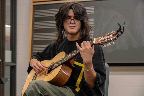 Gabriel Roethle, a world music second year masters student, practices a piece composed by Johann Sebastion Bach, “Lute Suite in E minor,” on Wednesday in Room 103 of the Music Building. NIU’s International Guitar Recital Series will start at 5 p.m. until 6 p.m. on Friday with guitarist Isaac Bustos. (Totus Tuus Keely | Northern Star)