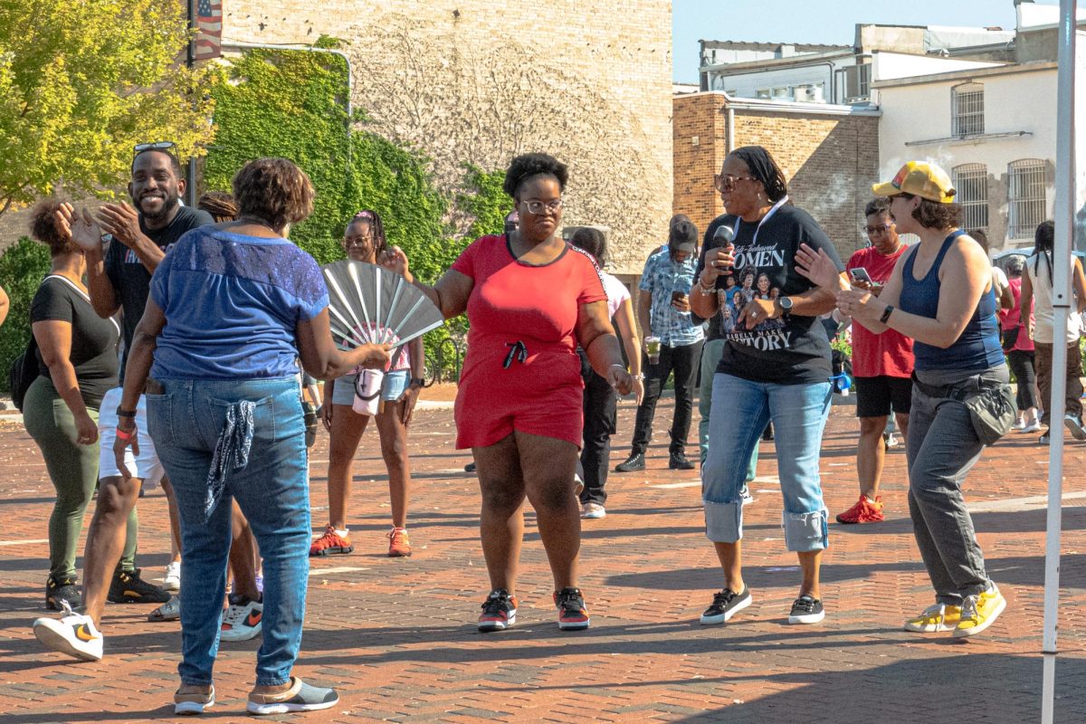 Attendees dance to the live house music hosted by Behind the Beats Pro from 2 p.m. to 5 p.m. on Sunday for DeKalb’s first House Music Fest in the Frank Van Buer Plaza. The fest featured food trucks, drinks from Fatty’s Pub & Grille and live DJs. (Totus Tuus Keely | Northern Star)