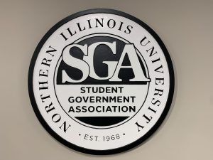 The Student Government Association sign hangs on a wall located in the Holmes Student Center ground floor in the OASIS space. SGA held elections for new and incumbent office holders in cabinet positions at its first meeting of the semester Friday. (Northern Star file photo)