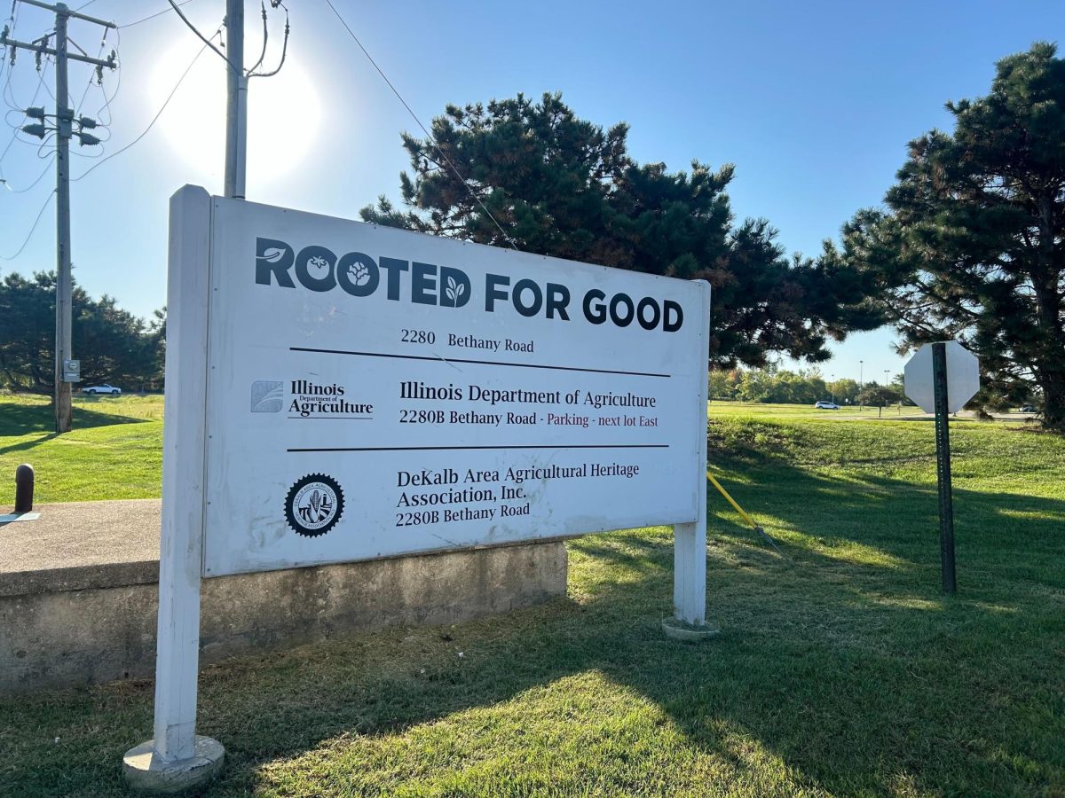 A Rooted for Good sign stands at 2280 Bethany Road in DeKalb. Rooted for Good is a nonprofit organization offering access to healthy and sustainably-sourced foods through its mobile food pantry. (Austin Lamb | Northern Star) 