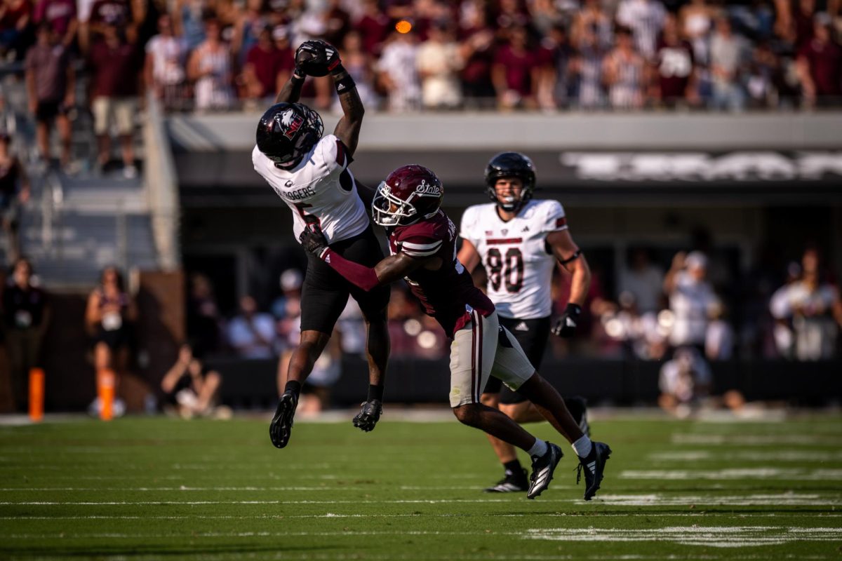 NIU junior wide receiver DeAree Rogers (6) makes a leaping catch over Mississippi State University redshirt senior safety Hunter Washington during the second quarter of Saturday’s non-conference football game at Davis Wade Stadium in Mississippi State, Mississippi. Rogers finished with six receptions for 84 yards and a touchdown in the Huskies’ 38-10 loss. (Courtesy of NIU Athletics)