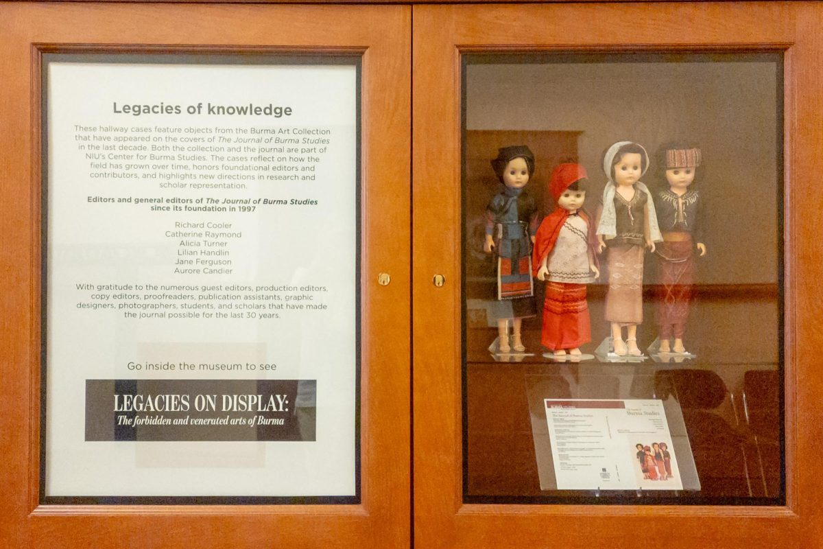 Dolls are stood up in a display case outside of the “Legacies on Display: The Forbidden and Venerated Arts of Burma” gallery in the west end of the first floor of Altgeld Hall. The exhibit is open 10 a.m. to 1 p.m. on Wednesdays, noon to 6 p.m. on Thursdays and Fridays and noon to 3 p.m. on Saturdays until May 9. (Totus Tuus Keely | Northern Star)