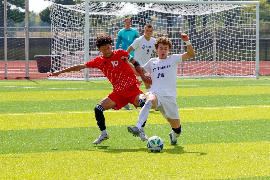 NIU men’s soccer senior midfielder Jose Gomez (10) battles for the ball during the Huskies’ game against St. Thomas University on Saturday. Gomez led the team with 4 shots in the 1-0 loss. (Marco Alvarez | Northern Star)
