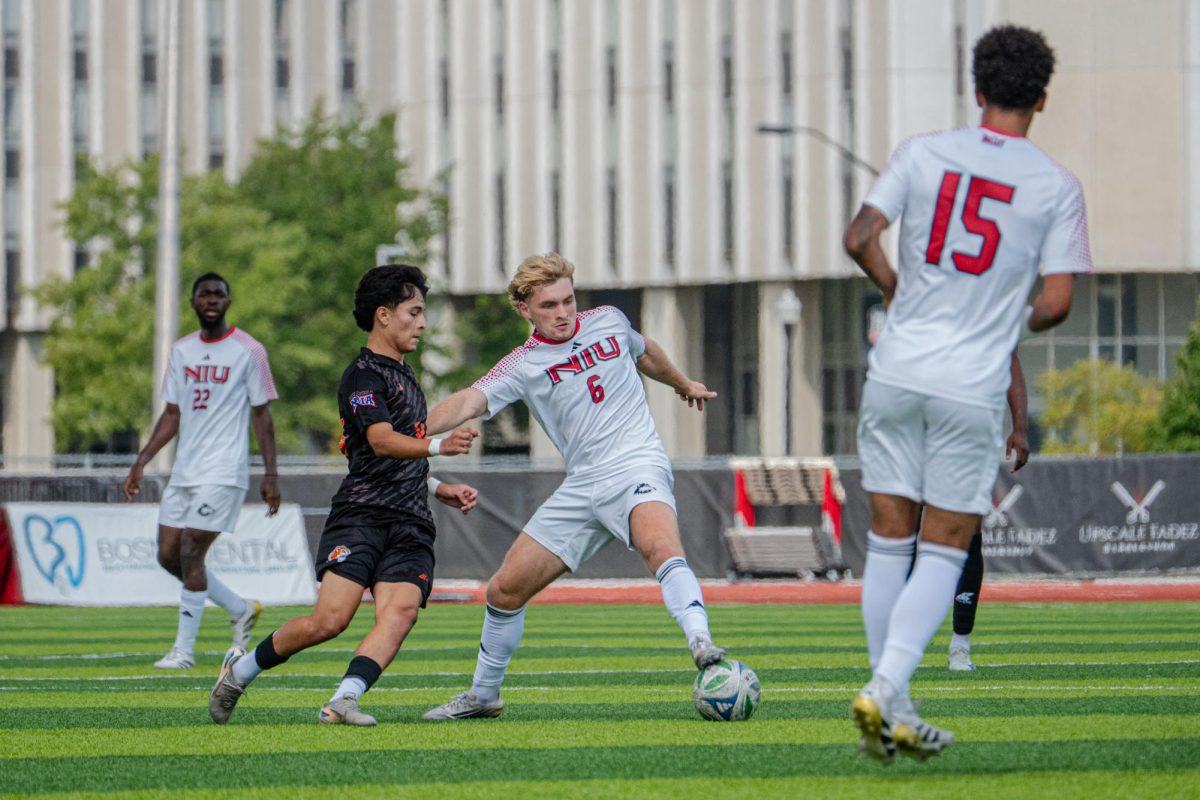 NIU men’s soccer redshirt junior midfielder Jakub Drazek (6) fights for possession of the ball during the Huskies’ match against Governors State University on Sept. 21. Drazek scored his first collegiate goal in NIU’s 1-1 draw with Drake University on Saturday. (Totus Tuus Keely | Northern Star)