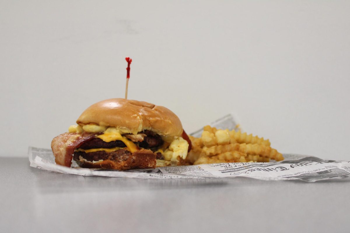 The Mac and Cheese Burger is one of many items in the new Huskie Den Grill menu curated by John Boswell, director of retail dining services. Boswell was inspired by the menu at a restaurant in Michigan and wanted to bring back some of the flavors he encountered. (Ethan Rodriguez | Northern Star) 