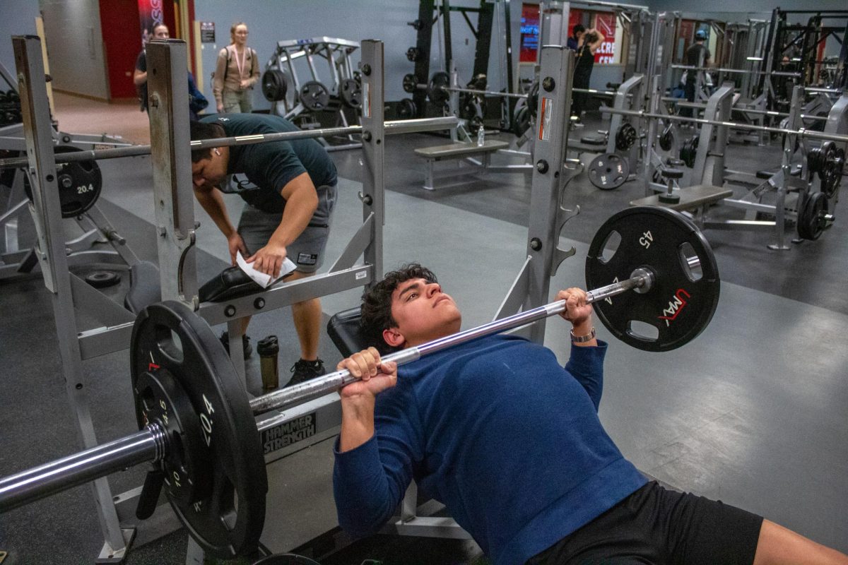 Santiago Morales, a then-sophomore mechanical engineering major, bench presses 155 pounds in the free weights section on March 4, 2024, at the NIU Recreation Center. NIU Recreation will host RecFest from 5 p.m. to 9 p.m. on Friday at the Outdoor Recreation Center. (Totus Tuus Keely | Northern Star)