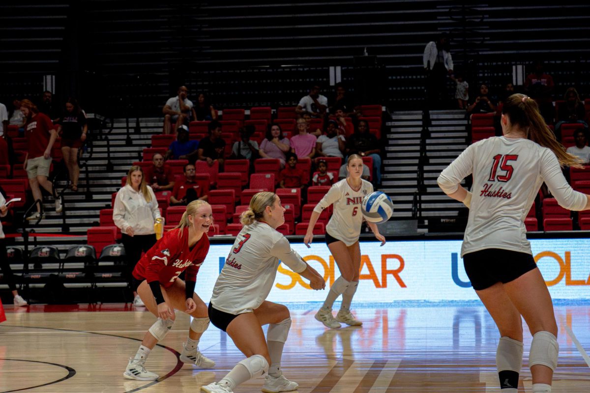 NIU volleyball sophomore outside hitter Ava Grevengoed (3) receives the ball from a DePaul University player during an exhibition match on Aug. 22. Grevengoed contributed 25 kills and 23 digs while helping lead the Huskies to wins against Merrimack College and Indiana State University on Friday. (Totus Tuus Keely | Northern Star)