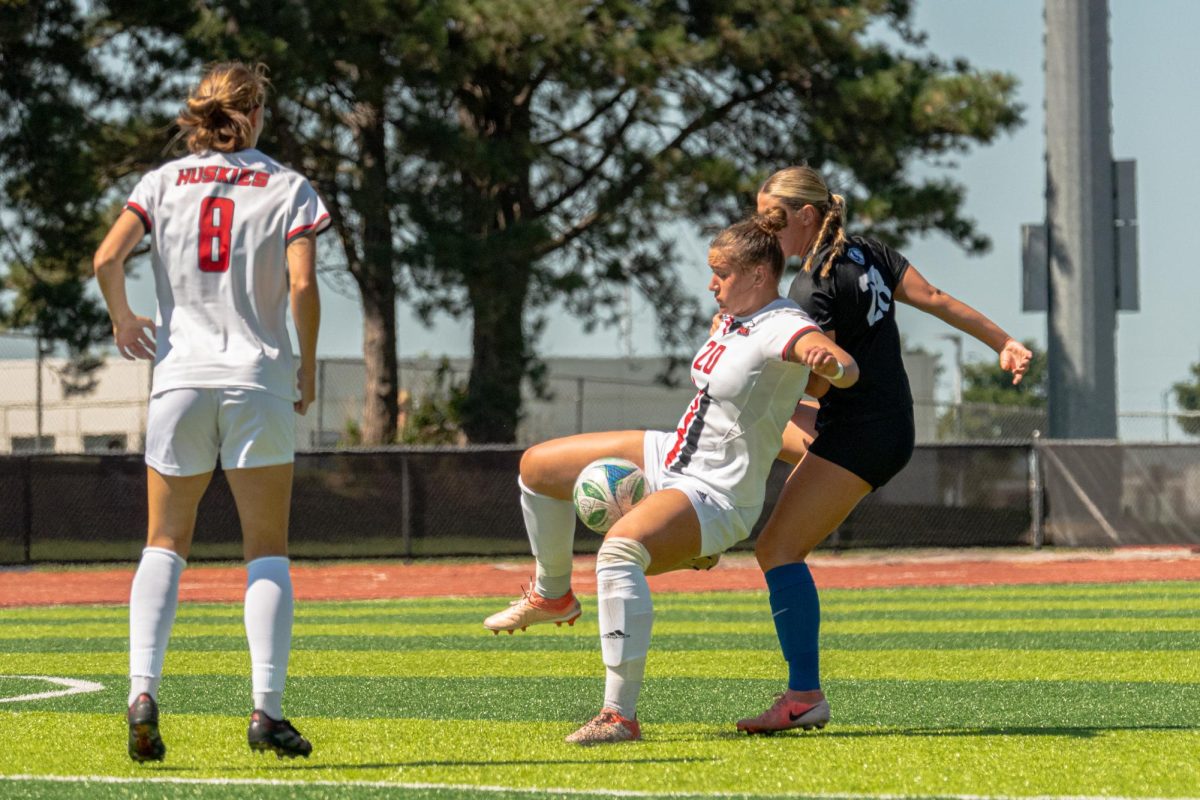 NIU women’s soccer sophomore defender Julianna Hill (20) receives and guards the ball from Eastern Illinois University’s defense on Aug. 31. The Huskies fell in a 3-0 game against the University of Wisconsin on Thursday, their final non-conference opponent before beginning Mid-American Conference play on Sept. 14.  (Totus Tuus Keely | Northern Star)