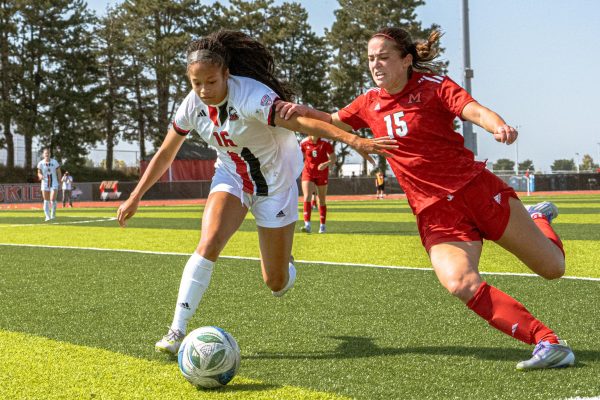 NIU women's soccer graduate defender Jordyn Saddler (16) fights for the ball with Miami University junior forward Katie O’Malley (15) near the east touchline on Sunday at the NIU Track and Field & Soccer Complex. NIU lost its MAC home opener 0-2 against Miami University with 0 shots in the first half and 7 missed shots in the second half. (Totus Tuus Keely | Northern Star)
