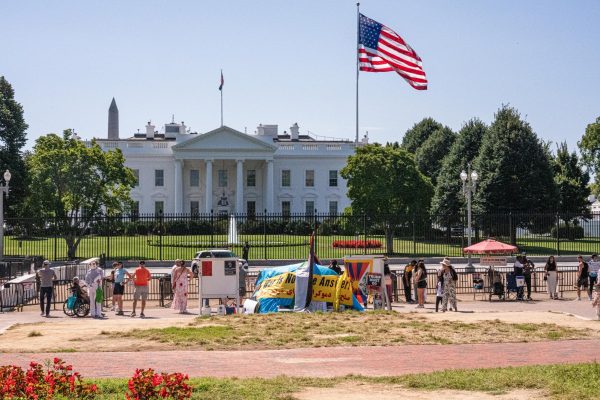 Several protest signs from different organizations are set up on Friday in the south end of Lafayette Square, Washington, D.C., at the edge of fencing on the north end of the White House. Groups such as the White House Peace Vigil and the Truth Conductor had signs promoting less hate in the world. (Totus Tuus Keely | Northern Star)