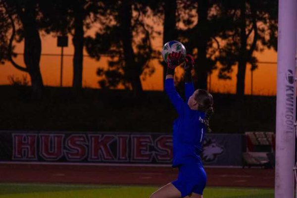 NIU women’s soccer sophomore goalkeeper Lauren Pearson (1) makes a save in the Huskies’ match against the University of Akron on Thursday. Pearson recorded 3 saves as NIU tied for the second straight match.  (Alexia Beck | Northern Star)