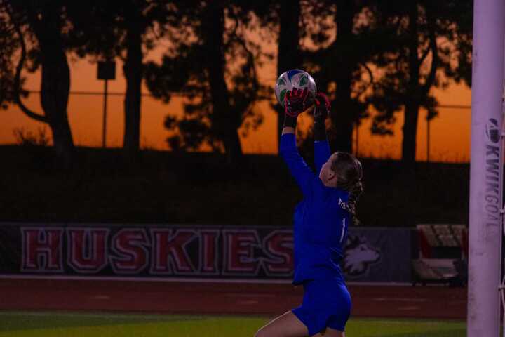 NIU women’s soccer sophomore goalkeeper Lauren Pearson (1) makes a save in the Huskies’ match against the University of Akron on Thursday. Pearson recorded 3 saves as NIU tied for the second straight match.  (Alexia Beck | Northern Star)
