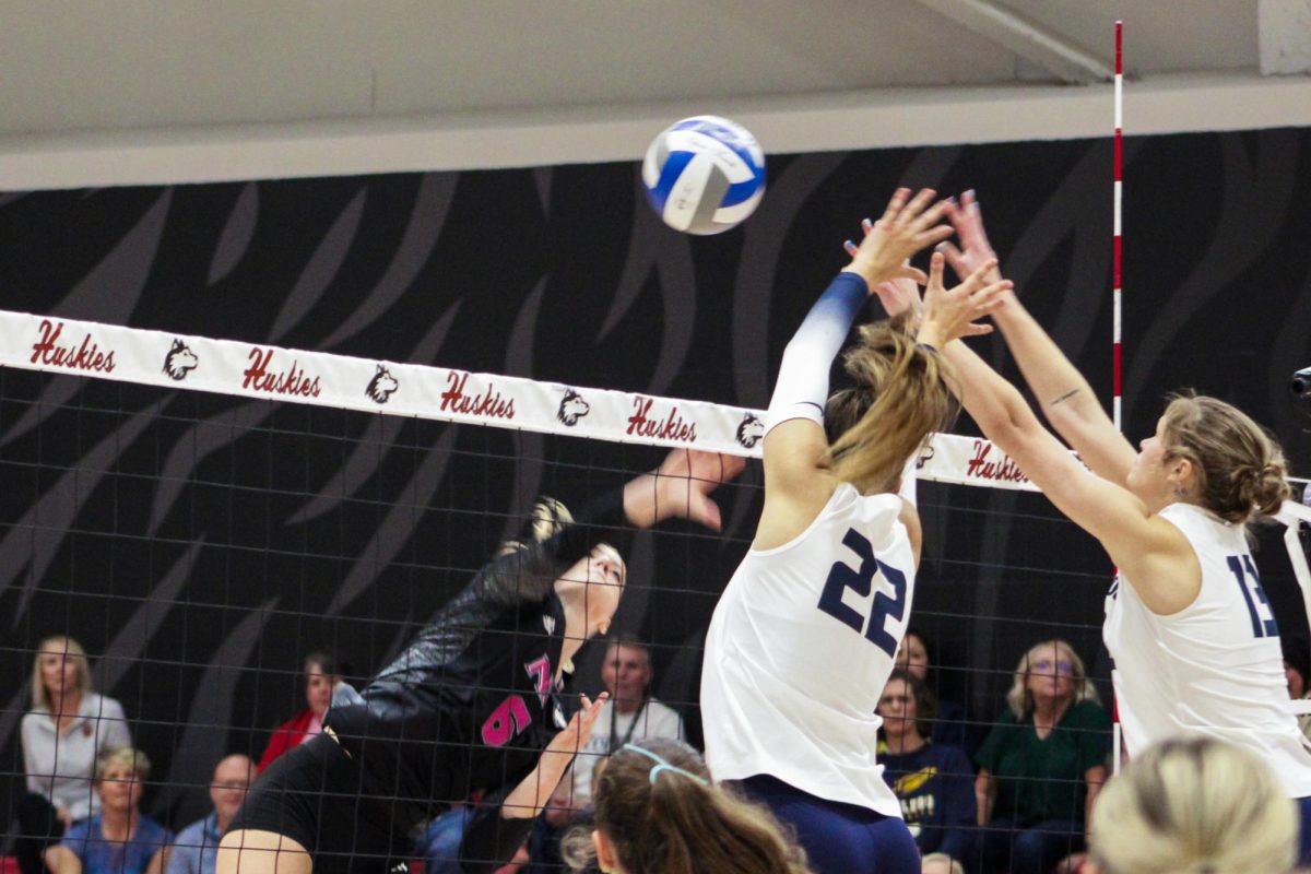 NIU volleyball sophomore outside hitter Emma McCartney (6) sends the ball over the net during the Huskies’ match against the University of Toledo on Friday. McCartney recorded 20 kills in the five set loss to Toledo on Saturday. (Ethan Rodriguez  | Northern Star)