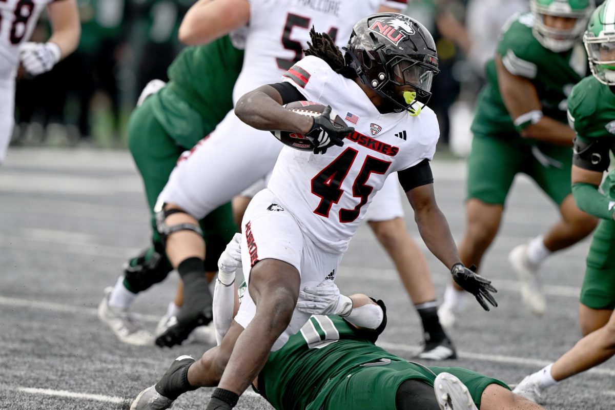 NIU sophomore running back Telly Johnson Jr. (45) carries the ball during a football game against Eastern Michigan University on Saturday at Rynearson Stadium in Ypsilanti, Michigan. Johnson finished with a season-high 137 rushing yards and a career-long 80-yard touchdown run. (Courtesy of NIU Athletics)