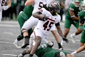 NIU sophomore running back Telly Johnson Jr. (45) carries the ball during a football game against Eastern Michigan University on Saturday at Rynearson Stadium in Ypsilanti, Michigan. Johnson finished with a season-high 137 rushing yards and a career-long 80-yard touchdown run. (Courtesy of NIU Athletics)