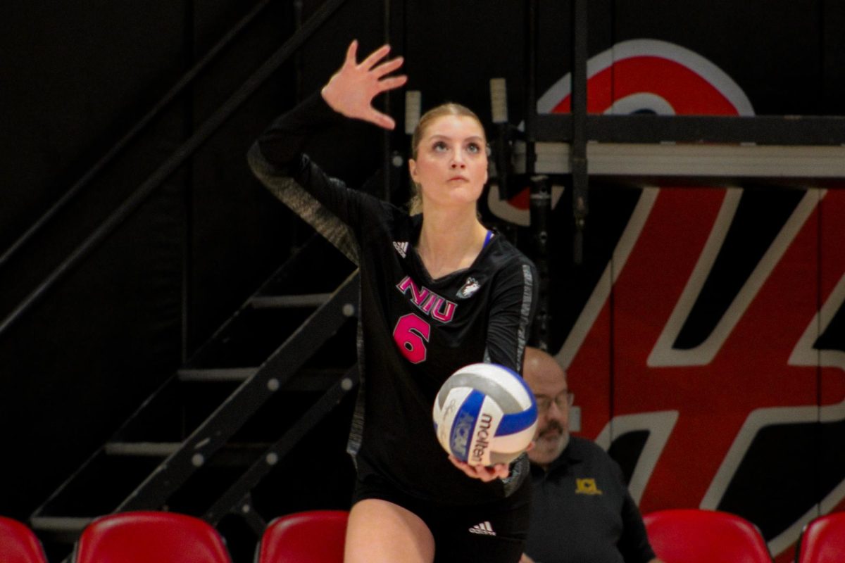 NIU volleyball sophomore outside hitter Emma McCartney (6) prepares to serve during the Huskies’ match against the University of Toledo on Friday. McCartney recorded 16 kills in NIU’s 3-1 loss to the Rockets, the third straight loss for the Huskies. (Ethan Rodriguez  | Northern Star)
