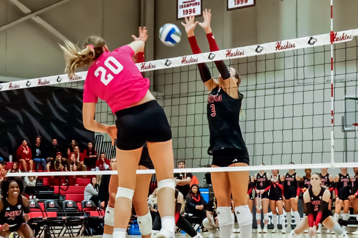 NIU volleyball sophomore outside hitter Ava Grevengoed (3) goes up for a block during the Huskies’ match against Western Michigan University on Tuesday. After winning the first set, the Huskies dropped three straight for a 3-1 loss against Bowling Green State University on Thursday. (Marco Alvarez | Northern Star)