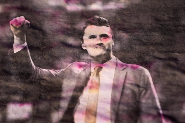 A poster picturing the recently assassinated conservative activist and commentator Charlie Kirk is displayed. In the weeks following Kirk's death, as many as over 40 professors were fired without due process for comments made on social media regarding the assassination. (REUTERS | Cheney Orr)
