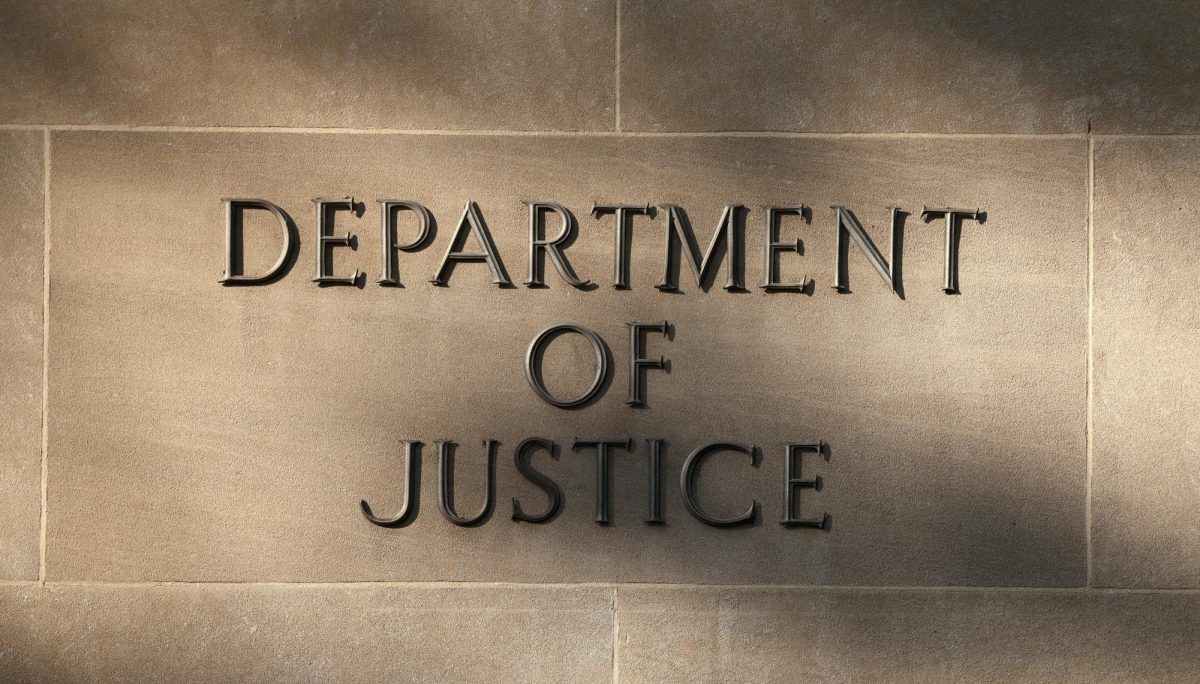 Shadows are cast on a sign Sept. 23 at the Department of Justice building in Washington, D.C. In August, the Department of Justice requested voter information from the Illinois State Board of Elections by Sept. 1, including driver’s licenses, dates of birth, state identification numbers and partial social security numbers. (REUTERS | Kevin Lamarque)