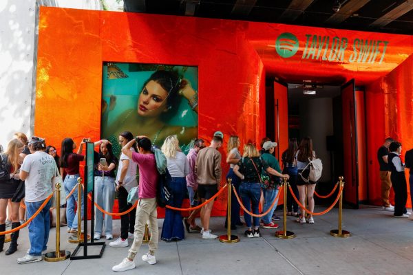 People wait to enter a Spotify pop-up event for Taylor Swift’s album "The Life of a Showgirl" in New York City on Sept. 30. Assistant Opinion Editor Emily Beebe believes this album is not as hard-hitting as Swift's prior albums. (REUTERS | Kylie Cooper) 