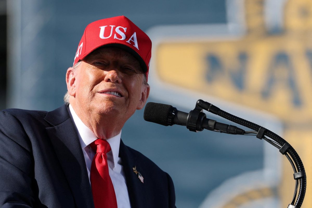 President Trump wears a “USA” hat and delivers remarks during a Navy 250 celebration. Opinion Columnist Ethan Ernst argues frequent speculation about Trump's health is not news. (Reuters | Jonathan Ernst)