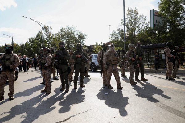 Chicago law enforcement officers intervene during a standoff with ICE and federal officers Sunday in Chicago. Opinion Columnist Santiago Montañez Bertoletti argues that President Donald Trump's views on immigration hurts the United States. (Reuters | Jim Vondruska)