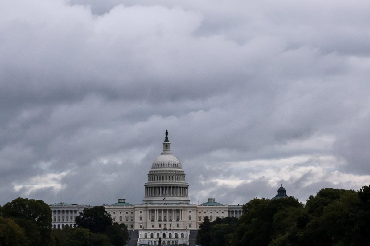 The U.S. Capitol Building sits on a cloudy day. Opinion Columnist Ethan Ernst argues that amid the government shutdown, America needs to learn how to compromise again. (Reuters | Jonathan Ernst)