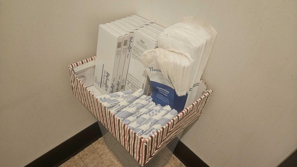 A bin of period products sits in a box. Opinion Columnist Habiba Kamel argues that period products should be free. (Kahlil Kambui | Northern Star)