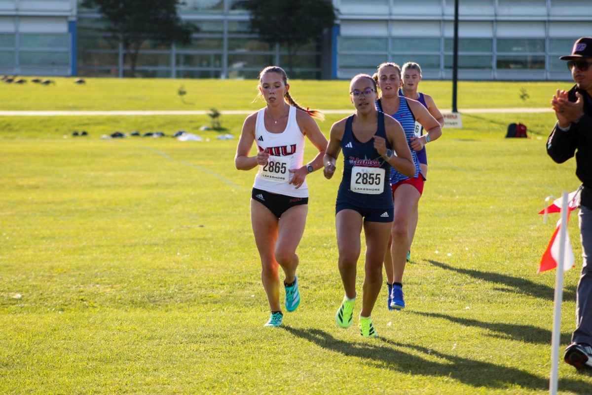 NIU cross country sophomore Varri Higgins competes at the Huskie Classic on Sept. 5. Higgins was one of five Huskies who ran personal records at the Bradley Pink Classic on Friday. (Ethan Rodriguez  | Northern Star)