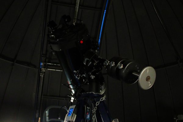 A telescope sits in the Davis Hall Observatory. The telescopes amplify what they’re viewing based on how big an object is, how far away it is and how much light the object emits. (Ethan Rodriguez | Northern Star)