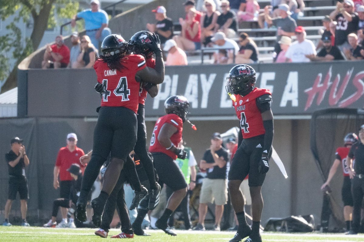 NIU football freshman defensive tackle Montrel Canion (44) celebrates a stop during the Huskies’ matchup against the San Diego State University Aztecs on Saturday. The Northern Star Sports staff shares their predictions for the outcomes of five college football games scheduled to take place this weekend. (Totus Tuus Keely | Northern Star)