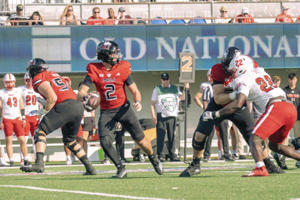 NIU freshman quarterback Brady Davidson (2) maneuvers around the pocket during the 118th Homecoming game against Miami University on Saturday at Huskie Stadium in DeKalb. Davidson made his first collegiate start in the 25-14 loss, for which NIU received a 52.8 offense grade from Pro Football Focus. (Northern Star file photo)