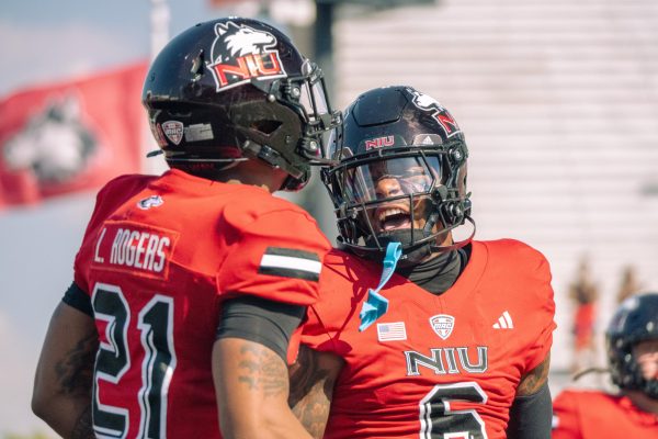 NIU junior wide receiver DeAree Rogers (6) celebrates with freshman running back Lazaro Rogers (21) after Rogers’ 76-yard touchdown run in the first quarter of NIU’s 118th Homecoming game against Miami University on Saturday at Huskie Stadium in DeKalb. The Huskies, now 1-4, will look to snap their four-game losing streak during their upcoming road trip to Eastern Michigan University. (Northern Star file photo)