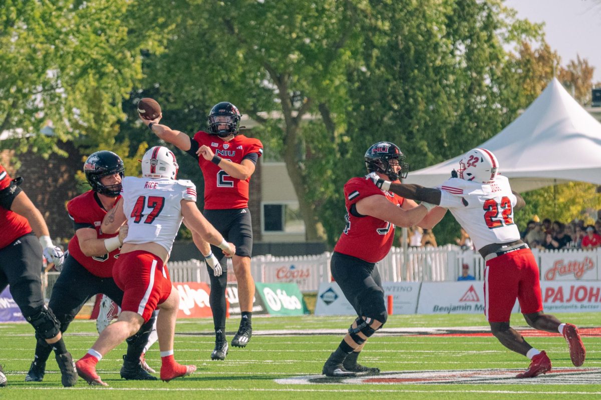 Freshman quarterback Brady Davidson (2) throws a 17 yard pass to redshirt junior tight end Jake Appleget for NIU’s second touchdown in the first quarter on Saturday against Miami University. NIU lost their MAC home-opener and 118th Homecoming game 25-14. (Totus Tuus Keely | Northern Star)