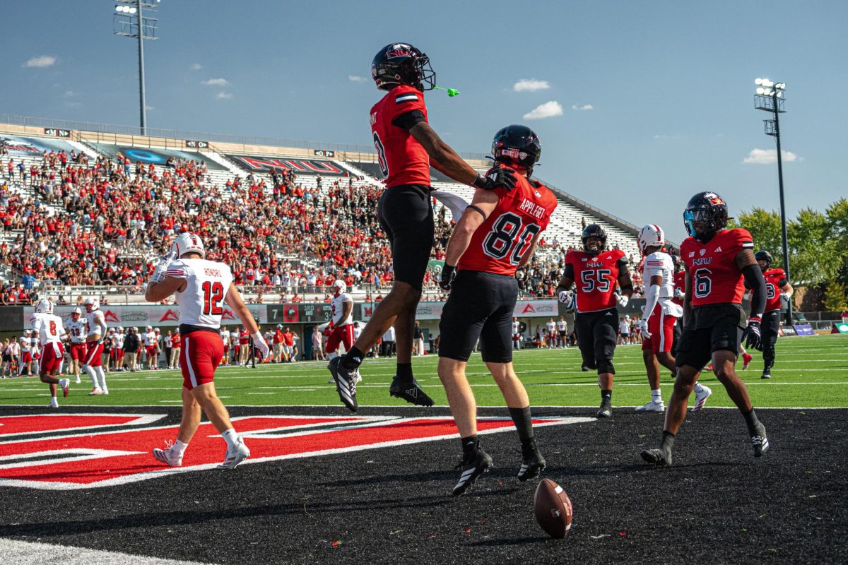 NIU redshirt junior tight end Jake Appleget (80) celebrates with redshirt freshman wide receiver La’Don Bryant (0) after catching a 17-yard touchdown pass in the first quarter of NIU’s 118th Homecoming game against Miami University at Huskie Stadium in DeKalb. The Huskies gave up 25 unanswered points from the RedHawks to lose 25-14. (Totus Tuus Keely | Northern Star)