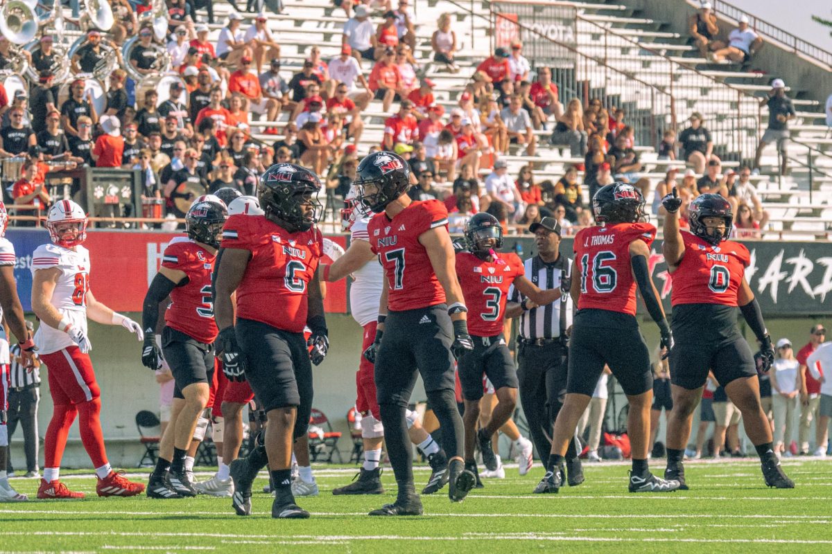 Members of the NIU football team meet after a play during the first quarter of the Huskies’ game against Miami University on Saturday. The Northern Star Sports staff shares their predictions for the outcomes of five college football games scheduled to take place this weekend. (Totus Tuus Keely | Northern Star)