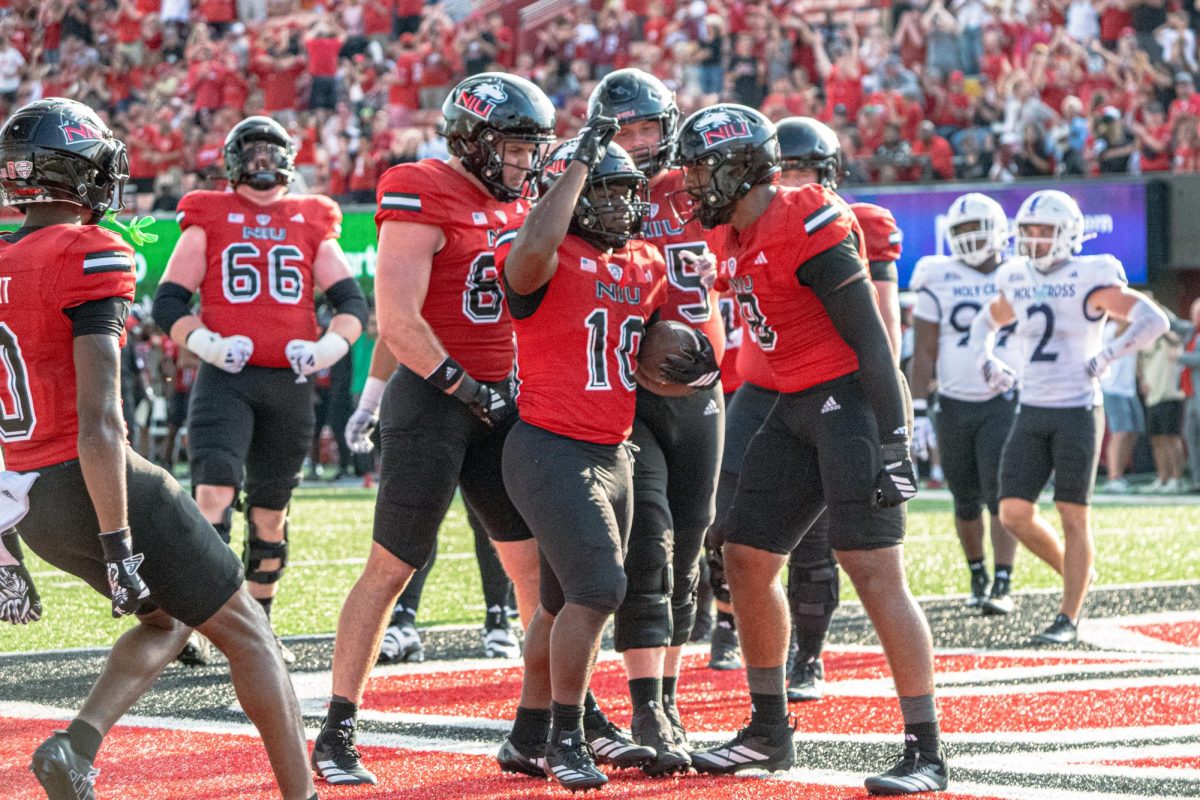 NIU football redshirt senior running back Chavon Wright (10) celebrates a touchdown during the Huskies’ game against the College of Holy Cross on Aug. 30. The Northern Star Sports staff shares their predictions for the outcomes of five college football games scheduled to take place this weekend.  (Totus Tuus Keely | Northern Star)