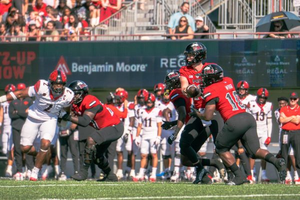 NIU football redshirt sophomore quarterback Josh Holst (15) hands the ball off to redshirt senior running back Chavon Wright (10) during the first quarter of the Huskies’ game against San Diego State on Sept. 27. Sports Reporter Logan Whittington shares his three greatest takeaways from NIU’s 48-21 loss to Ohio University on Saturday. (Northern Star file photo)