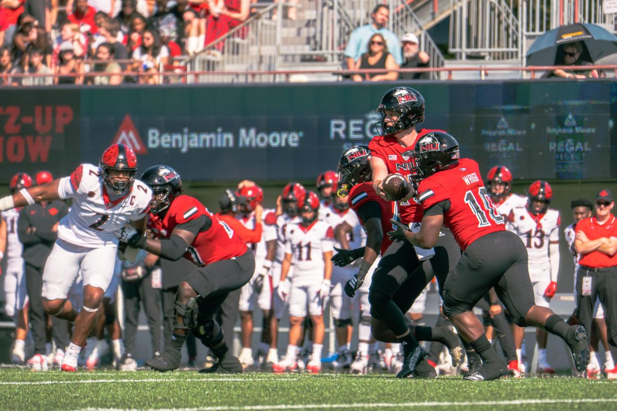 NIU football redshirt sophomore quarterback Josh Holst (15) hands the ball off to redshirt senior running back Chavon Wright (10) during the first quarter of the Huskies’ game against San Diego State on Sept. 27. Sports Reporter Logan Whittington shares his three greatest takeaways from NIU’s 48-21 loss to Ohio University on Saturday. (Northern Star file photo)