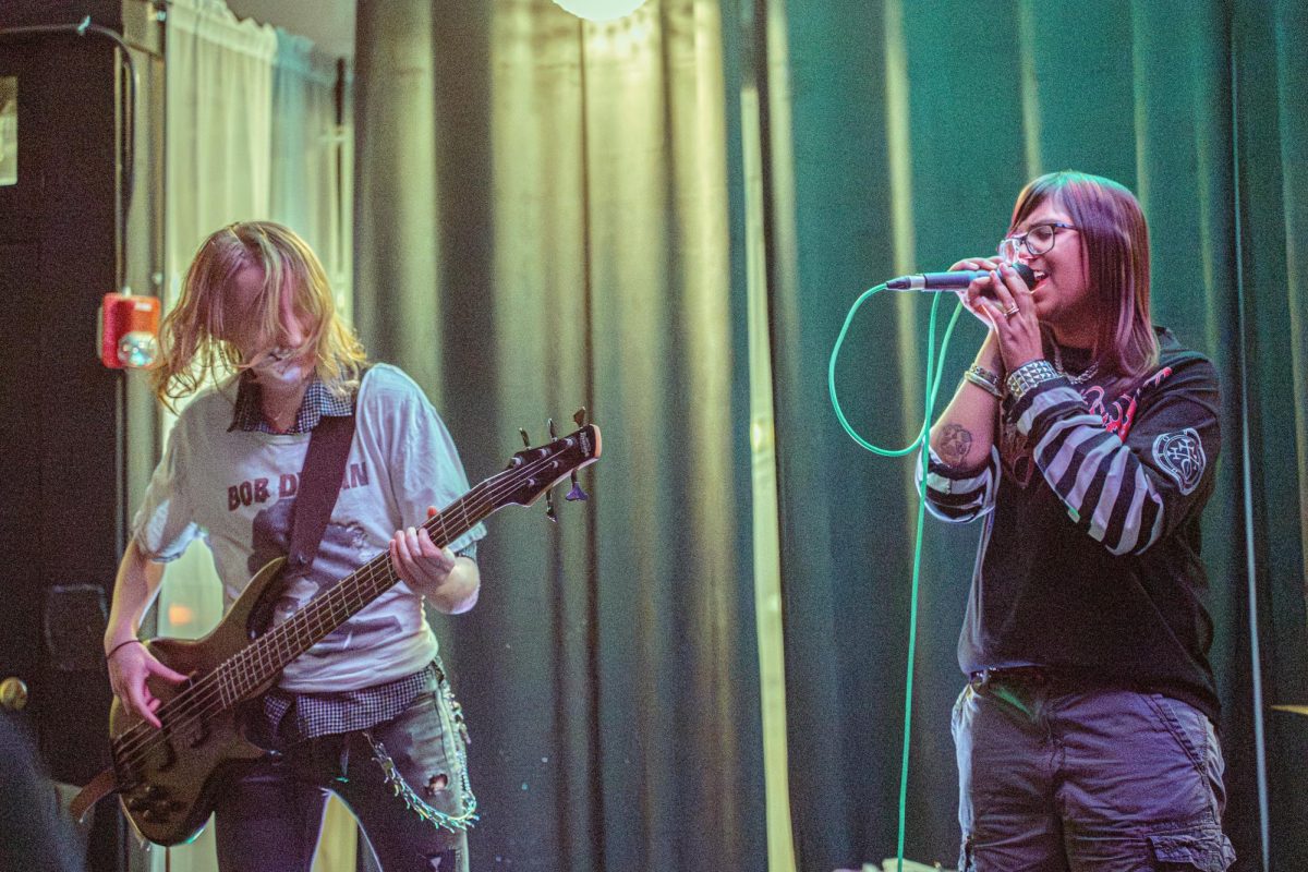 Trinity Balboa (left) and Shefali Sharma perform during Murder Medication's show Saturday at the Fargo Venue. The show, which began at 7 p.m., featured sets from three bands, No Better Today, Murder Medication and Take Care of Yourself. (Brynn Krug | Northern Star)