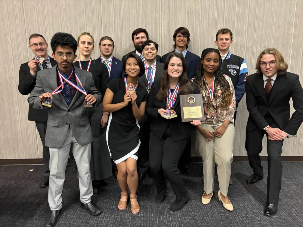 The NIU Forensics team pose for the camera at the Applequist Speech and Debate Tournament hosted by Moraine Valley Community College. NIU Forensics won third place in the four-year university division at the tournament. (Photo courtesy of AJ Evon)