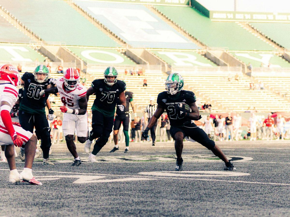 Eastern Michigan University graduate student running back Dontae McMillan (28) carries the ball during a football game against the University of Louisiana at Lafayette on Sept. 20 at Rynearson Stadium in Ypsilanti, Michigan. McMillan ranks second in the Mid-American Conference with 88.8 rushing yards per game. (Julius Stewart | The Eastern Echo)