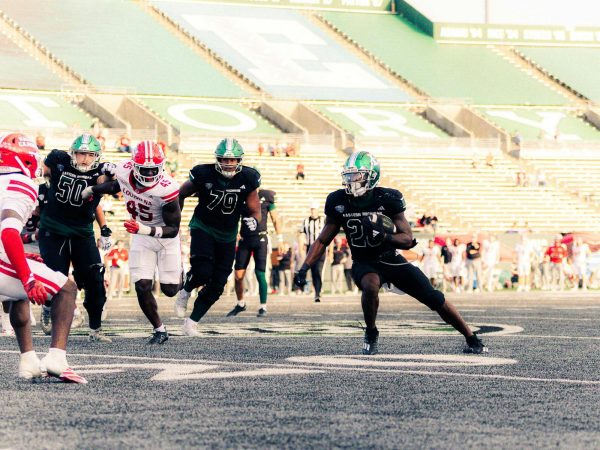 Eastern Michigan University graduate student running back Dontae McMillan (28) carries the ball during a football game against the University of Louisiana at Lafayette on Sept. 20 at Rynearson Stadium in Ypsilanti, Michigan. McMillan ranks second in the Mid-American Conference with 88.8 rushing yards per game. (Julius Stewart | The Eastern Echo)