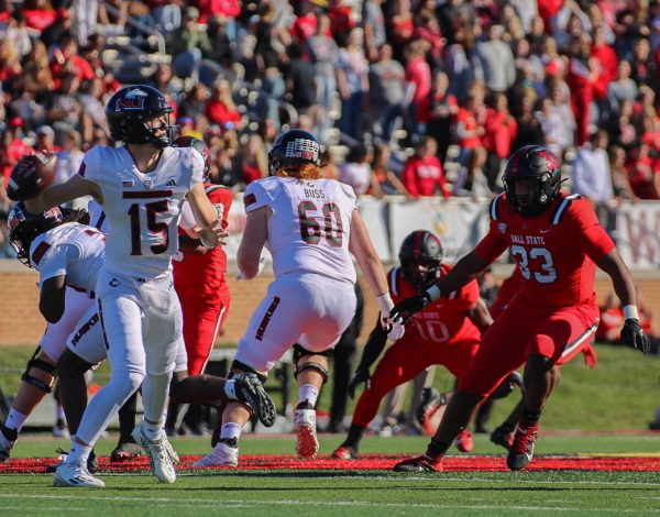 NIU then-redshirt freshman quarterback Josh Holst (15) throws a pass during a football game against Ball State University on Oct. 26, 2024, at Scheumann Stadium in Muncie, Indiana. The Huskies lost the game 25-23 after a walk-off field goal by the Cardinals, tying the all-time series between the rivals at 25-25-2. (Northern Star file photo)