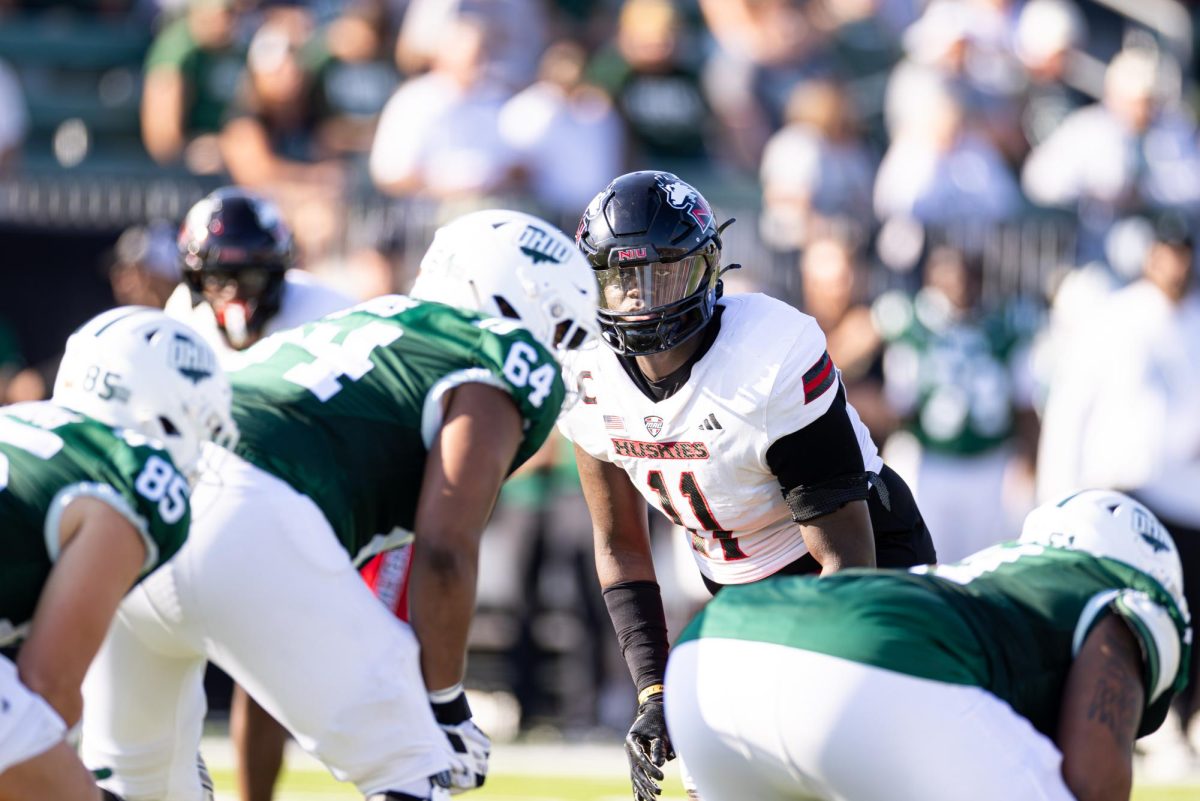 NIU redshirt senior defensive end Jalonnie Williams (11) waits for Ohio University’s offense to snap the ball during a football game on Saturday at Peden Stadium in Athens, Ohio. The Huskies will next host archival Ball State University, looking to reclaim the Bronze Stalk trophy for the first time since 2021. (Jimmy Doles | NIU Athletics)