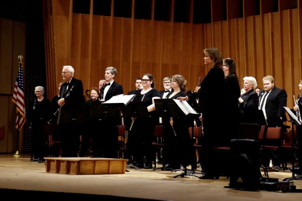 Members of the Kishwaukee Concert Band take a bow as the audience applauds at the end of their concert on Sunday in the Boutell Memorial Concert Hall. Their next performance will be a Holiday Concert at 3 p.m. on Dec. 20. (Marco Alvarez | Northern Star)