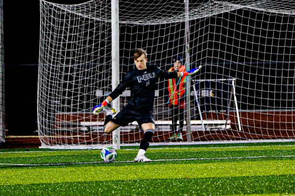 NIU men’s soccer redshirt sophomore goalkeeper Caleb Pearson (0) clears the ball during the Huskies' match against the University of Notre Dame on Tuesday. Pearson recorded a career-high 7 saves in NIU's 2-1 victory over the University of Illinois Chicago on Saturday. (Marco Alvarez | Northern Star)